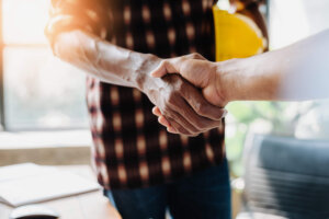 construction workers shaking hands