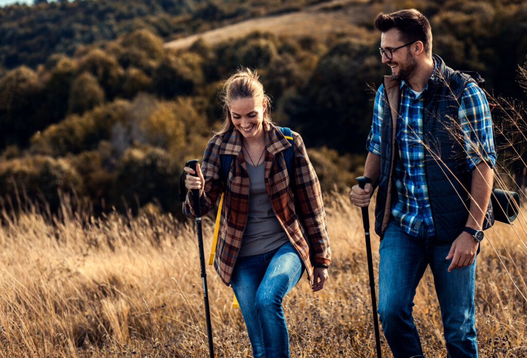 Couple with backpacks hiking together