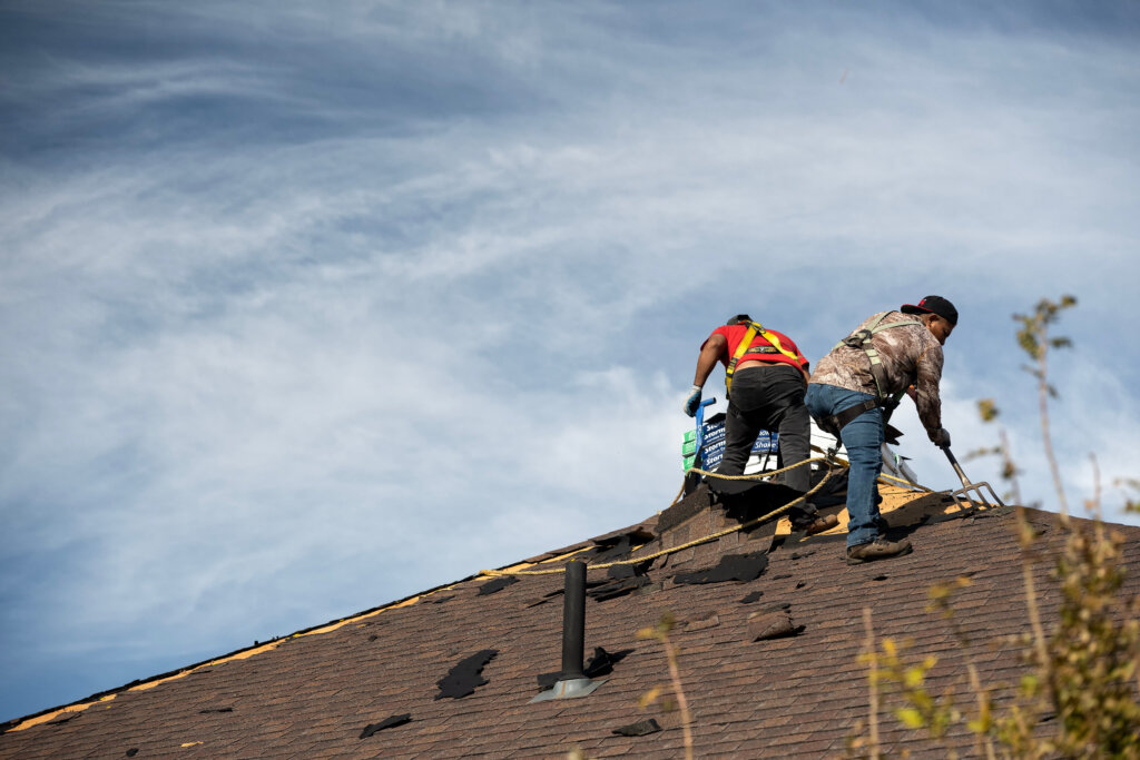 Reroofing house after hail storm