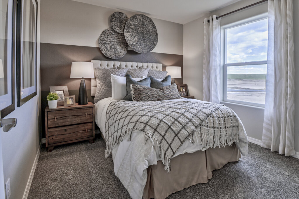 Furnished model home bedroom by Challenger Homes
