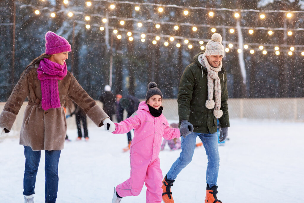 A family of three ice skating in Colorado Springs