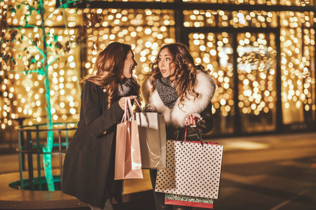 Two girls enjoying holiday shopping in Colorado Springs