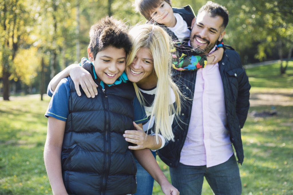 Mixed-race family enjoying in public park