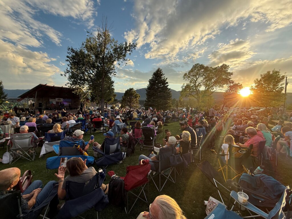 Crowd gathered at an outdoor concert in the town of Monument, Colorado.